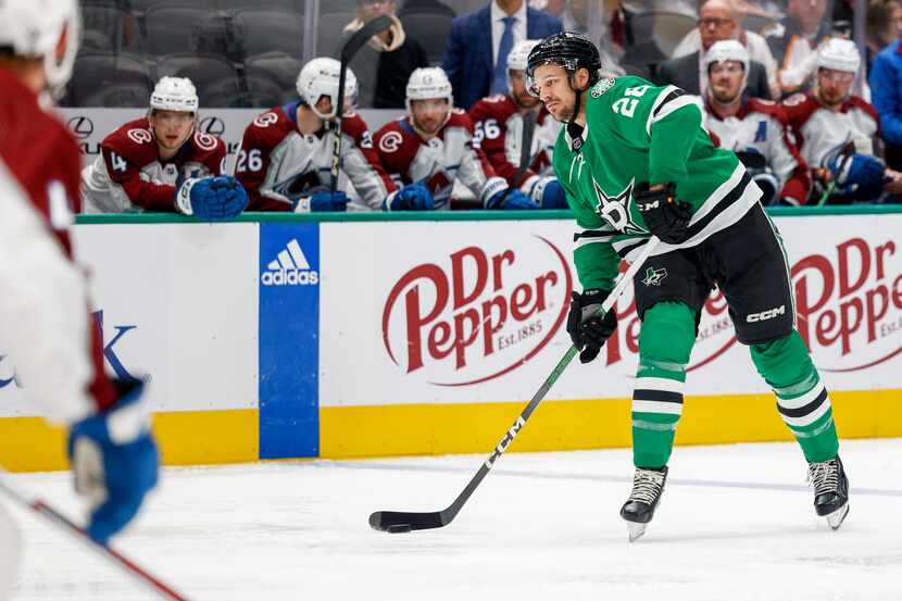 Dallas Stars defenseman Alexander Petrovic (28) looks to pass during the first period of an...
