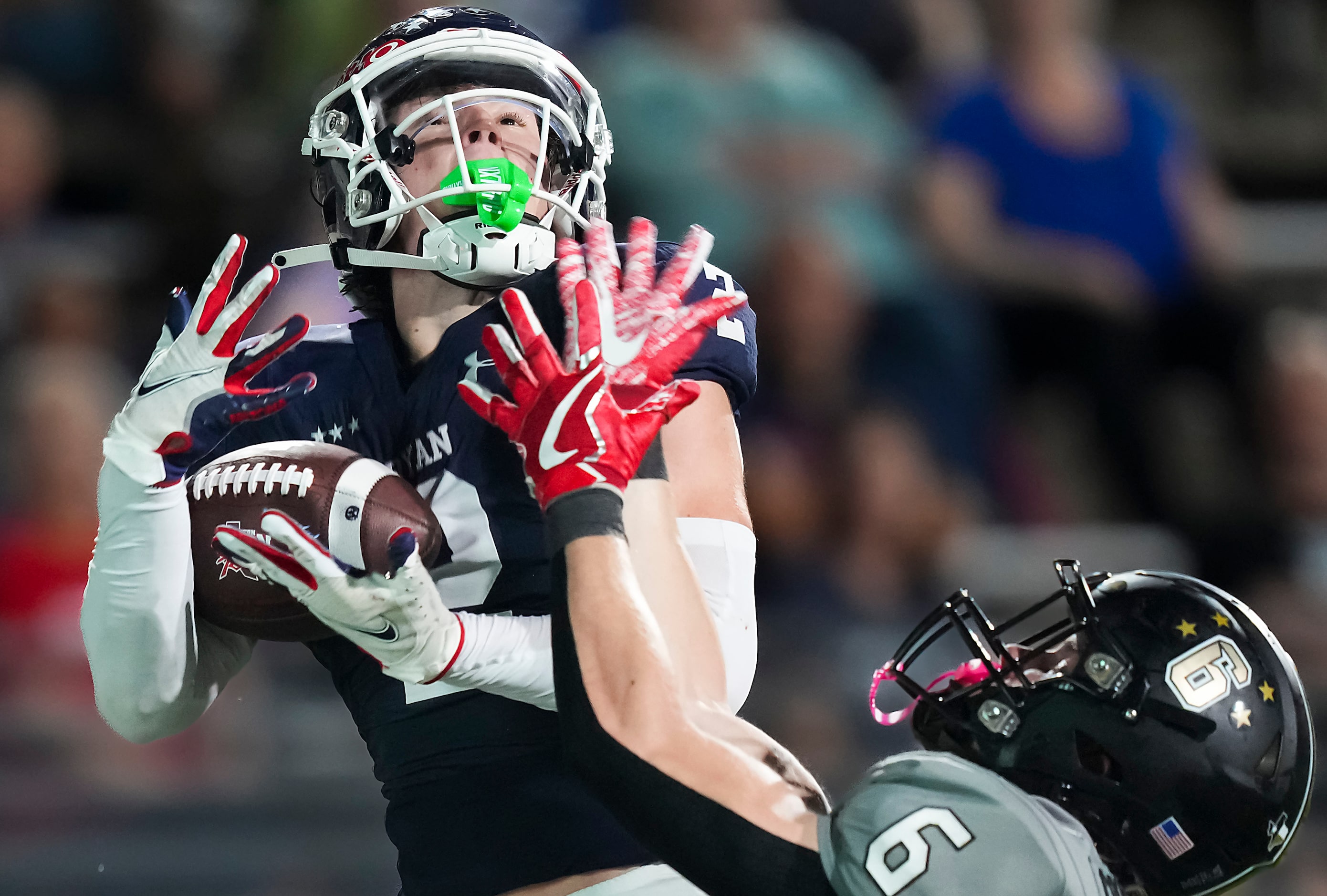 Denton Ryan’s Braeden Mussett (2) hauls in a 45-yard touchdown pass as The Colony defensive...