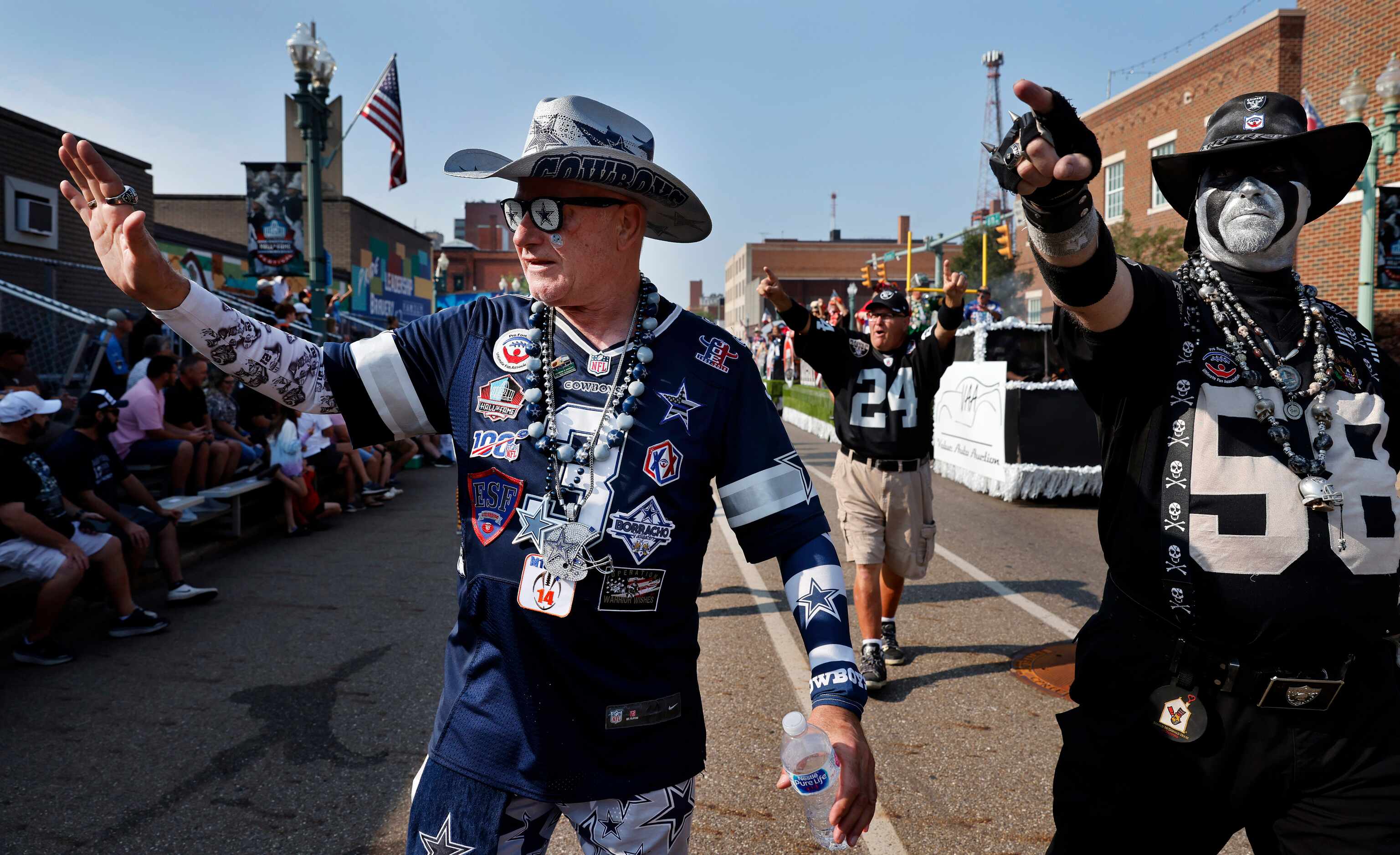 Dallas Cowboys fan Lloyd Wheeler of Fort Worth marches with other NFL mascots in the Canton...