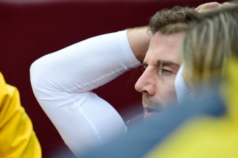 LANDOVER, MD - NOVEMBER 18: Alex Smith #11 of the Washington Redskins reacts as he is carted...