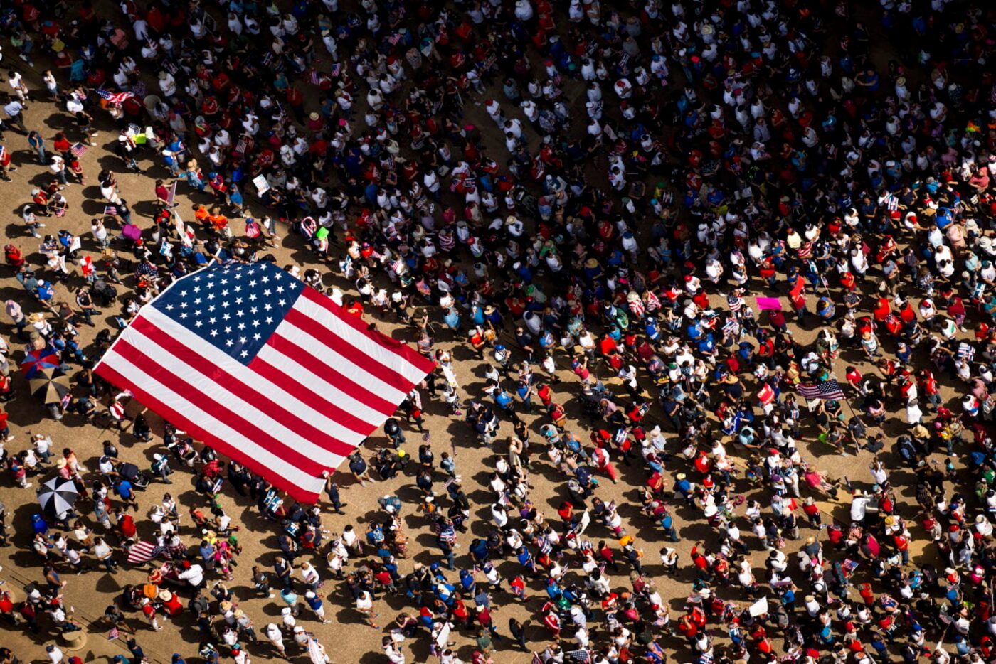 Demonstrators rally outside city hall at the end of  the 2017 Dallas Mega March on Sunday,...