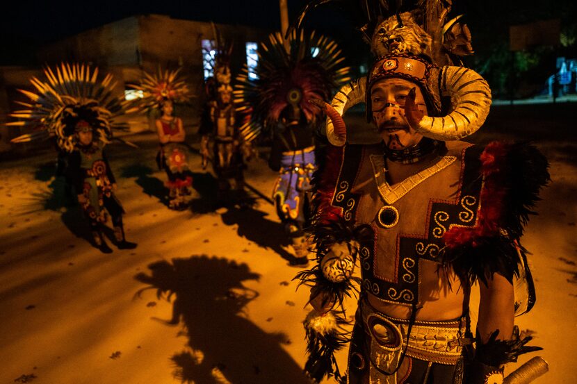 Dancer Arnulfo Diaz (right) prepares for dress rehearsal with other members of Danza...