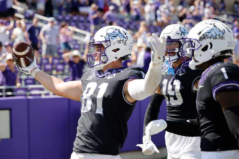 TCU Horned Frogs tight end Chase Curtis (81) celebrates his touchdown with his teammates...