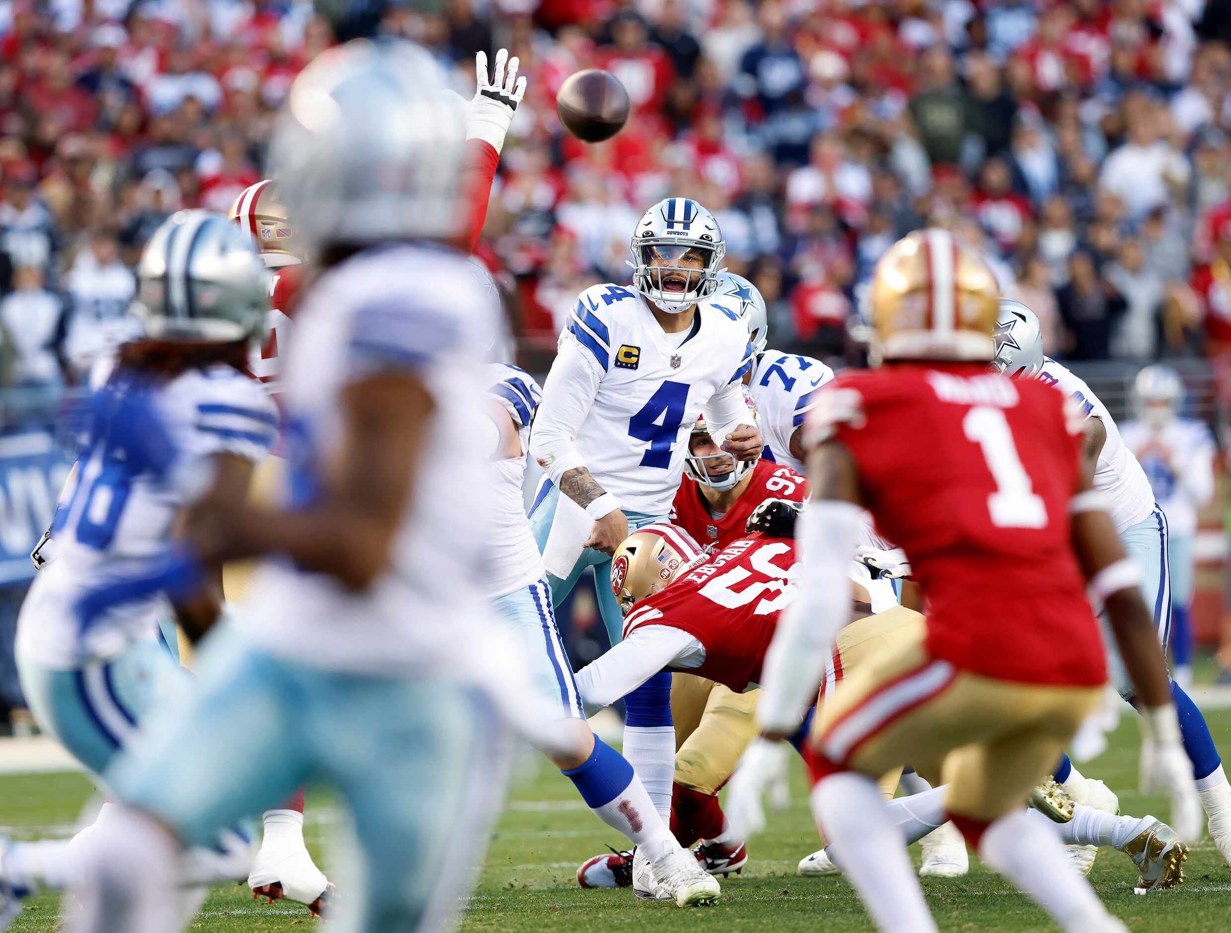 Dallas Cowboys quarterback Dak Prescott (4) throws a pass intended for wide receiver CeeDee...