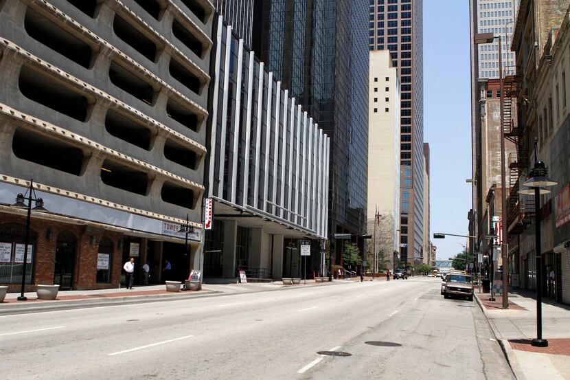 The 1960s parking garage (left) is less than a block from Thanksgiving Tower.