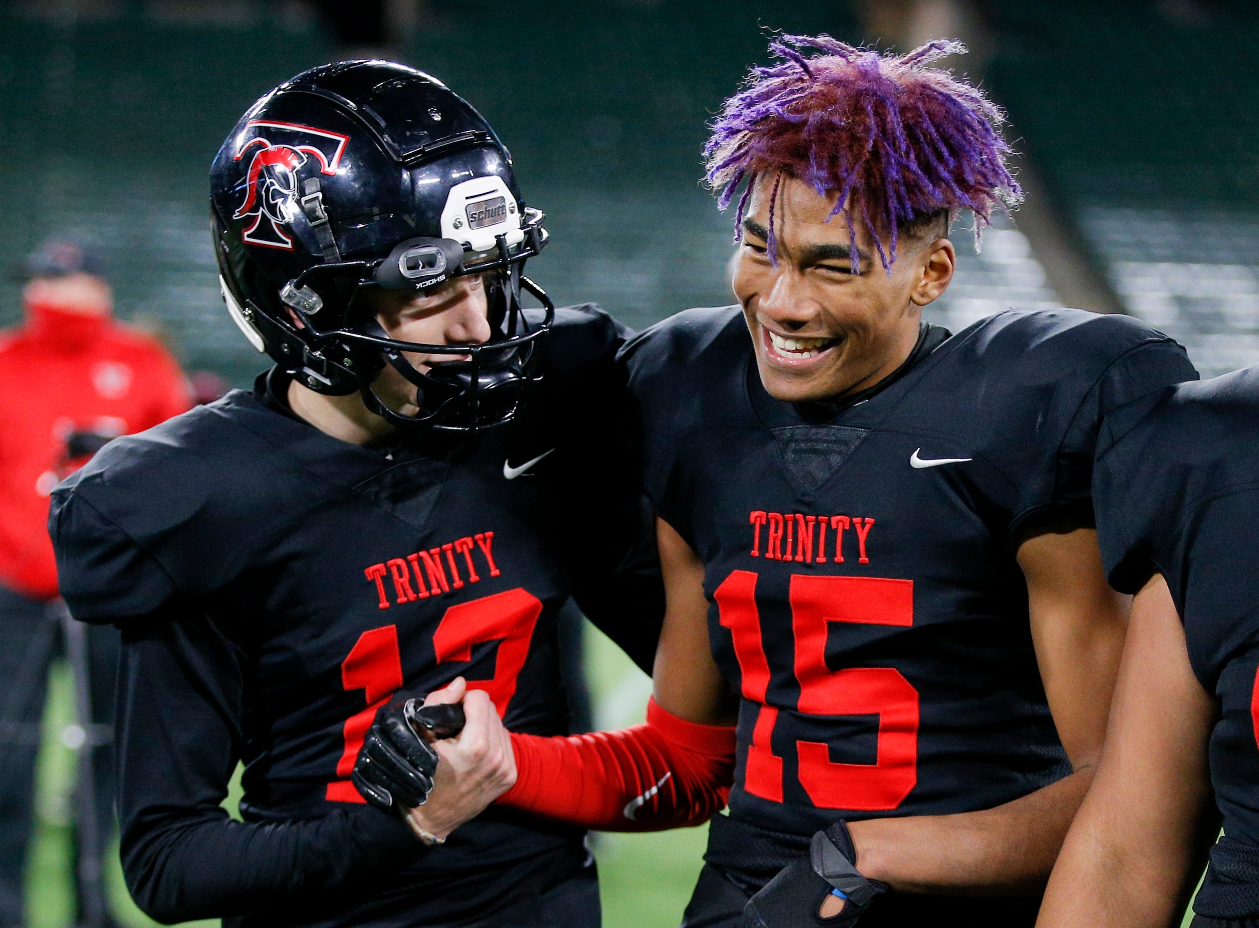 Euless Trinity junior quarterback Cade Barthelemess (12) and junior wide receiver Pofele...