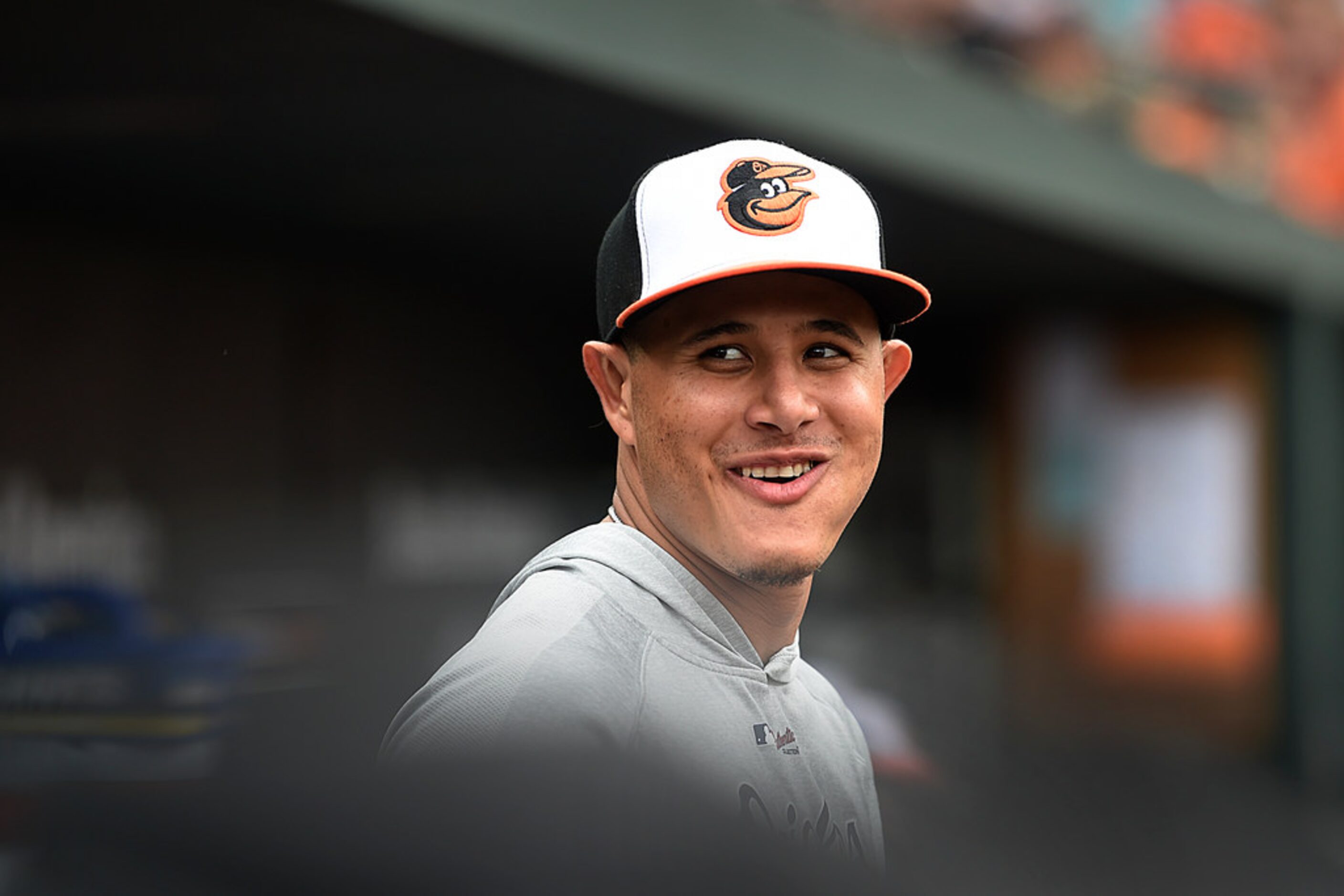 Baltimore Orioles' Manny Machado smiles in dugout after leaving the game against the Texas...