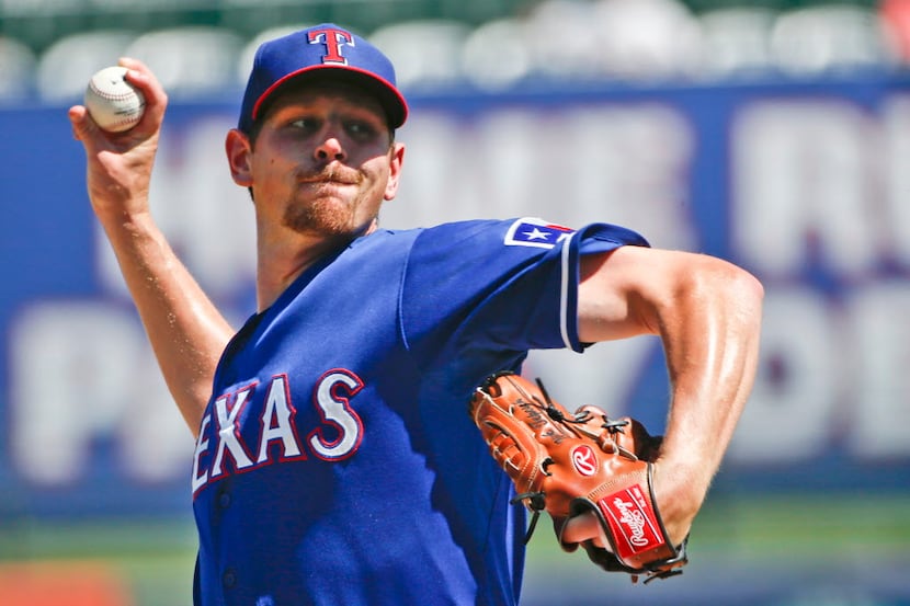 Texas Rangers starting pitcher Nick Tepesch works the first inning against the Los Angeles...
