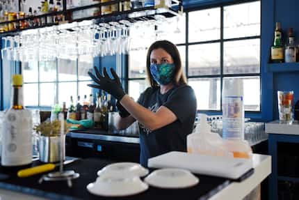 Bartender Tara Dieringer says,  places gloves on while cleaning the bar at RM 12:20 Bistro,...