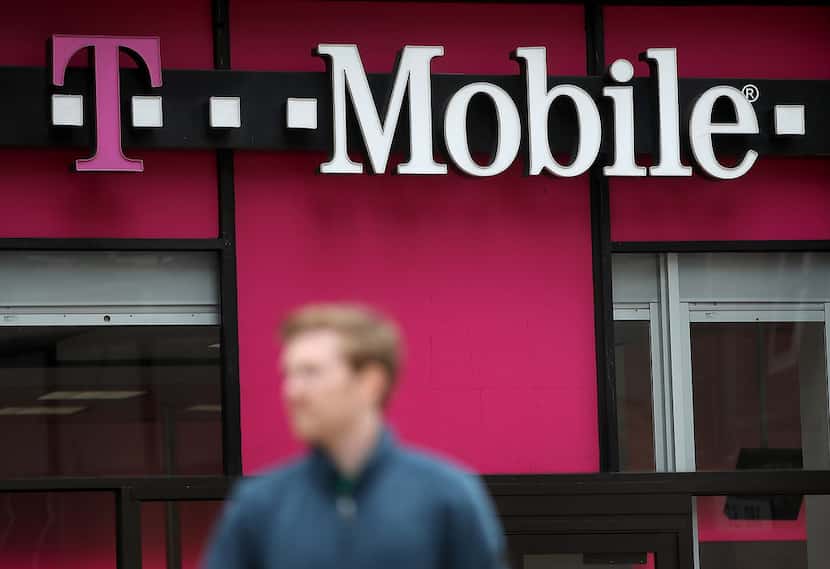T-Mobile says it is cooperating with law enforcement to investigate the thefts of dozens of...