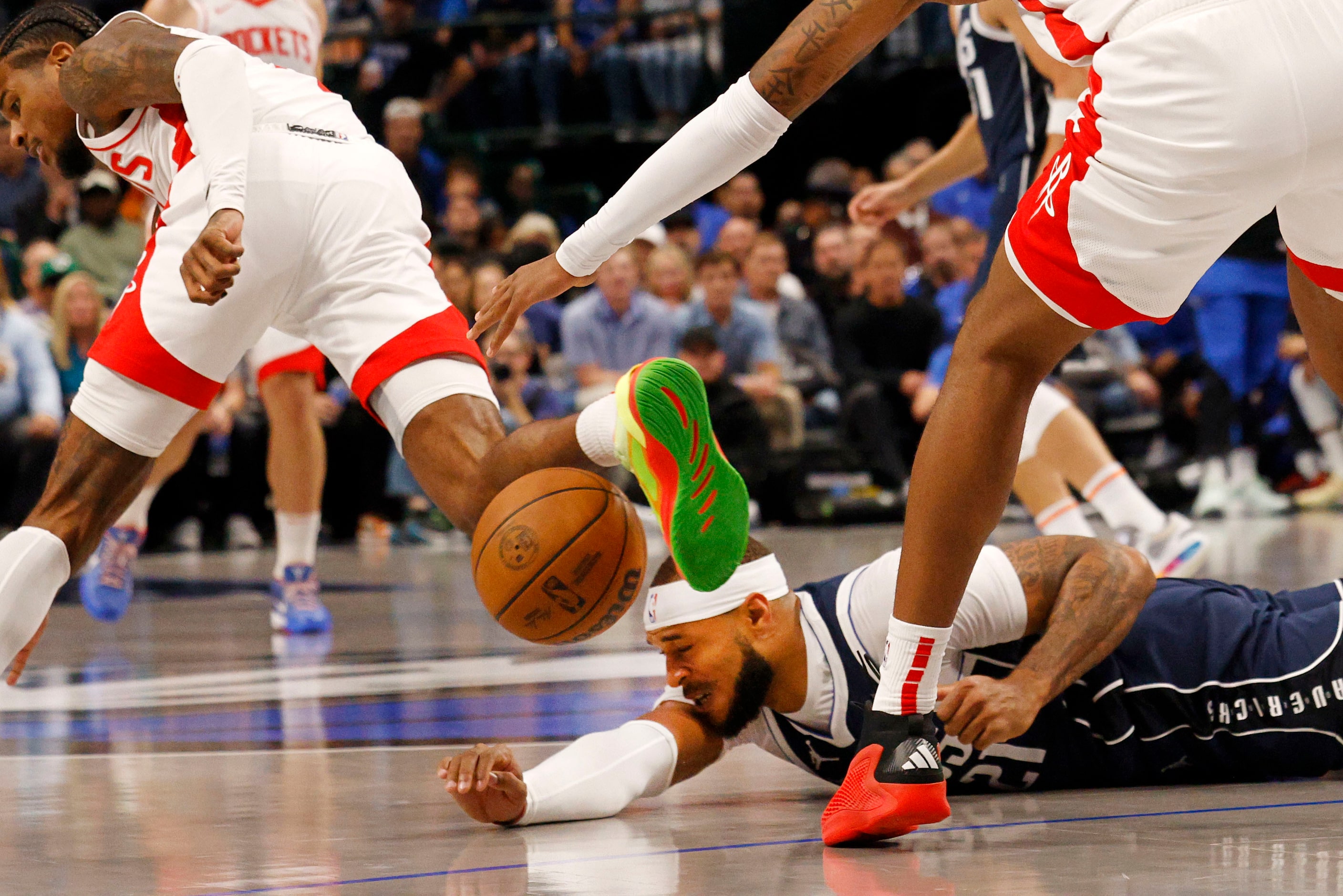 Dallas Mavericks center Daniel Gafford (21) loses a ball under pressure from Houston Rockets...