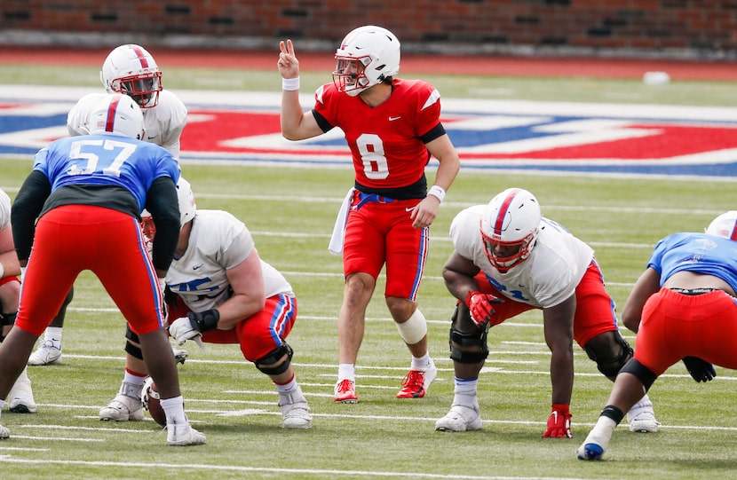 SMU quarterback Tanner Mordecai (8) signals during practice at Gerald Ford Stadium,...