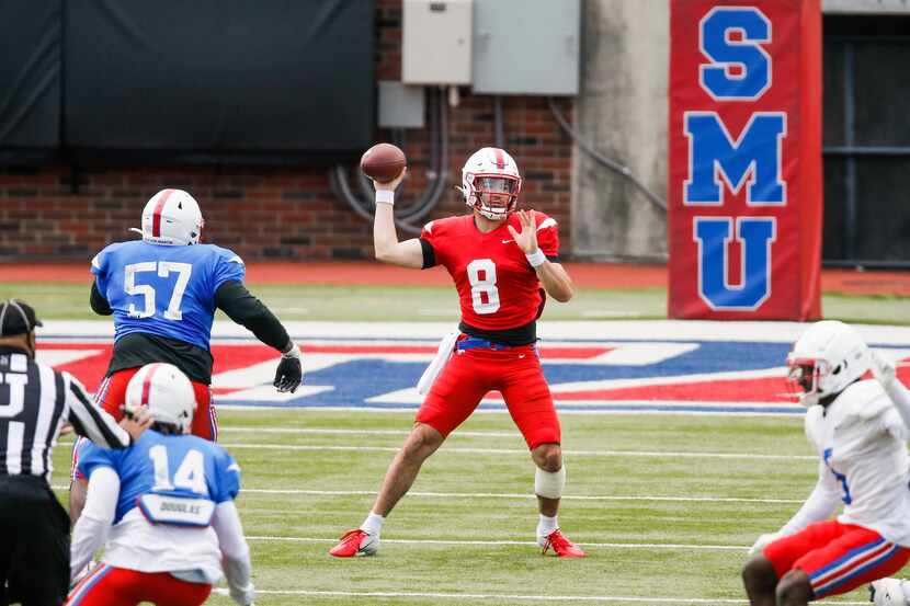 SMU quarterback Tanner Mordecai (8) throws during practice at Gerald Ford Stadium, Saturday,...