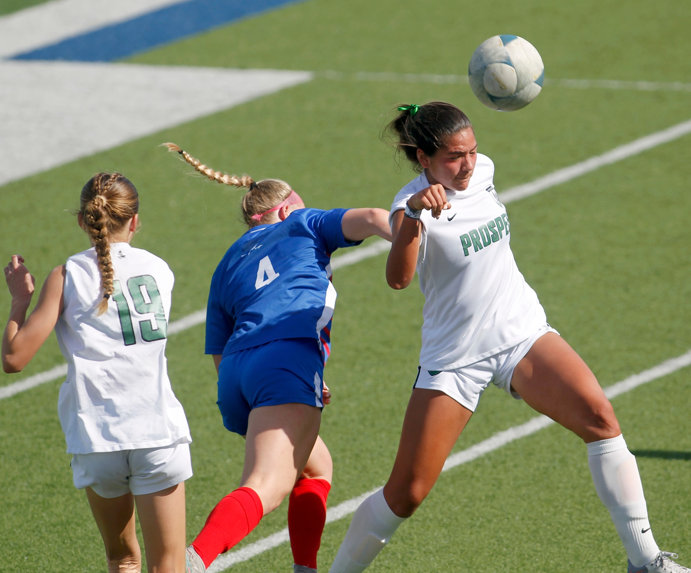 Prosper defenseman Beya Rosales (3), right, heads the ball away from Austin Westlake...