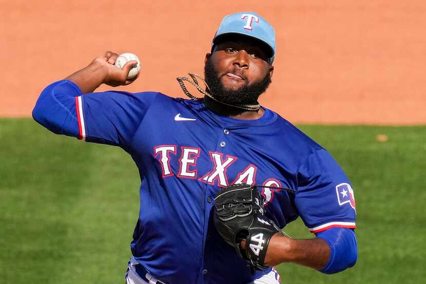 Texas Rangers pitcher Diego Castillo delivers during the seventh inning of a spring training...