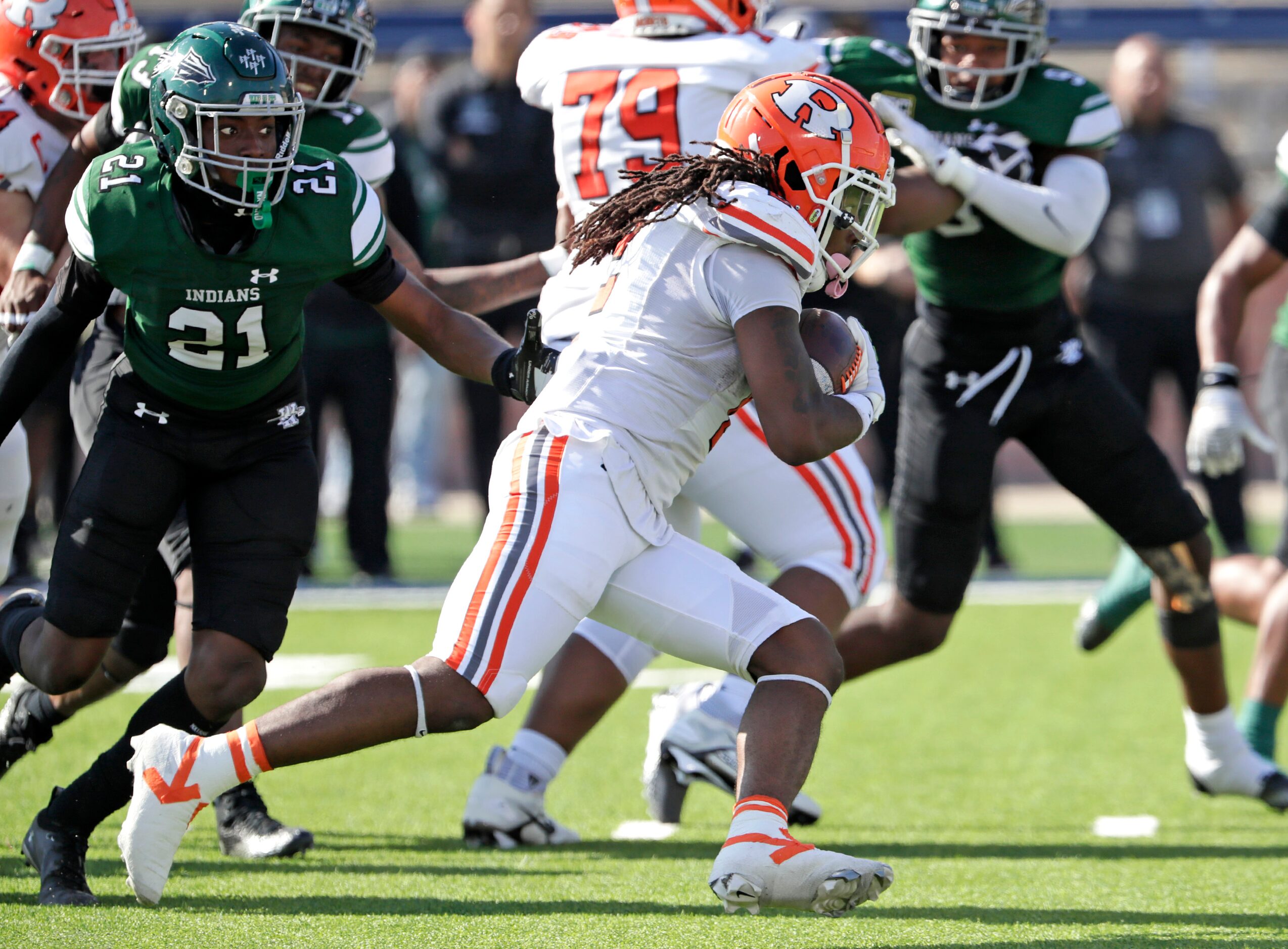 Rockwall High School running back Ashten Emory (2) scores a touchdown on this run during the...