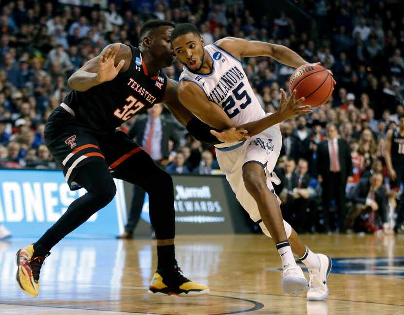 Villanova's Mikal Bridges, right, tries to drive past Texas Tech's Norense Odiase during the...