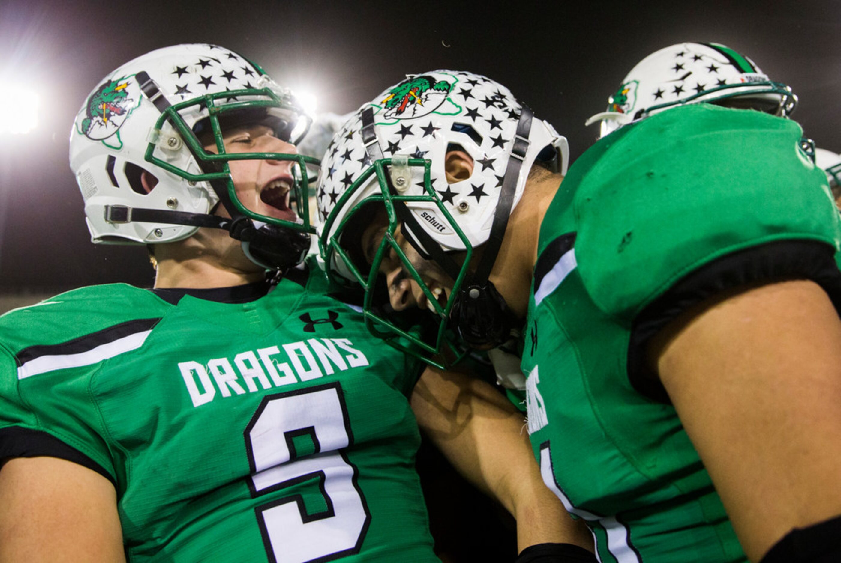 Southlake Carroll football players celebrate a 35-7 win over Euless Trinity on Friday,...