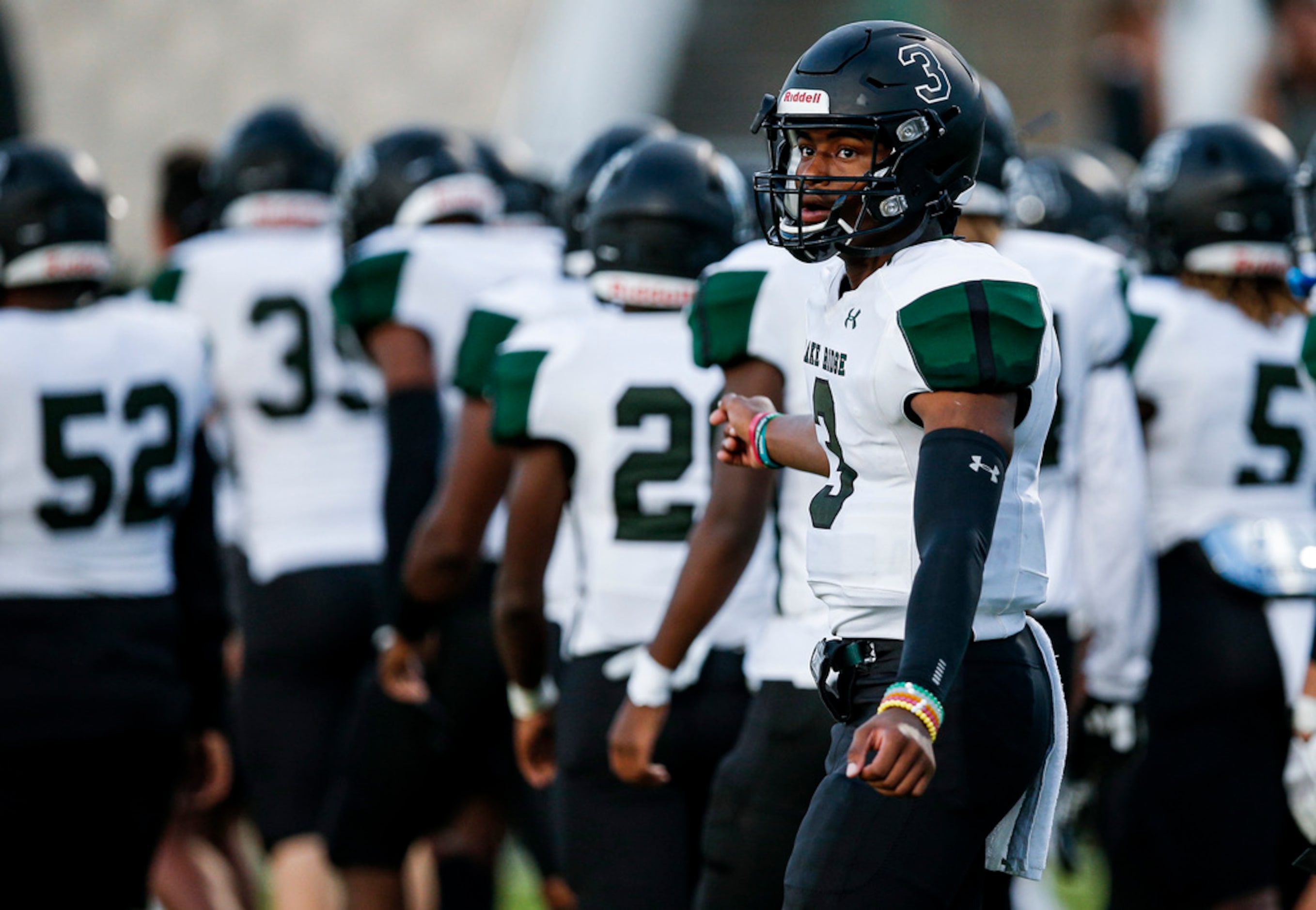 TXHSFB Mansfield Lake Ridge senior quarterback Adrian Hawkins (3) looks on before the start...