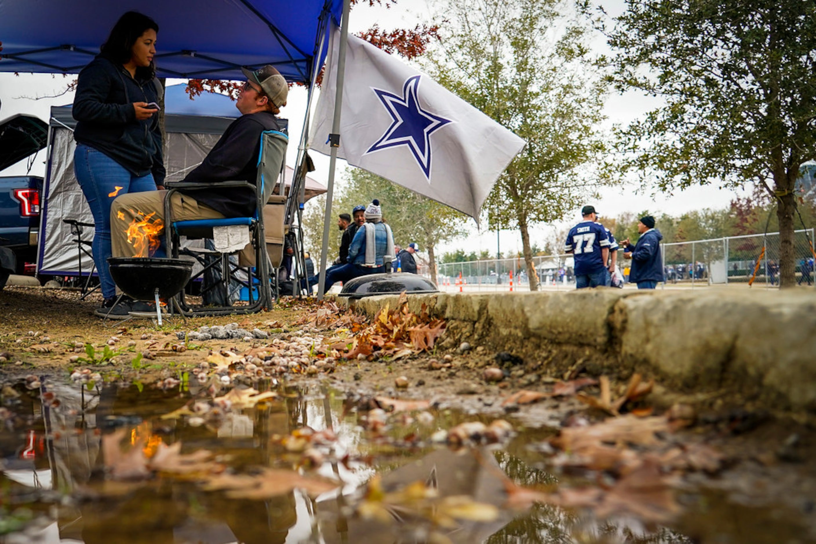 Fans tailgate before an NFL football game between the Dallas Cowboys and the Buffalo Bills...