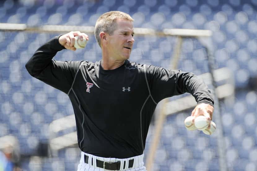 Texas Tech coach Tim Tadlock throws batting practice at TD Ameritrade Park before Tech's...
