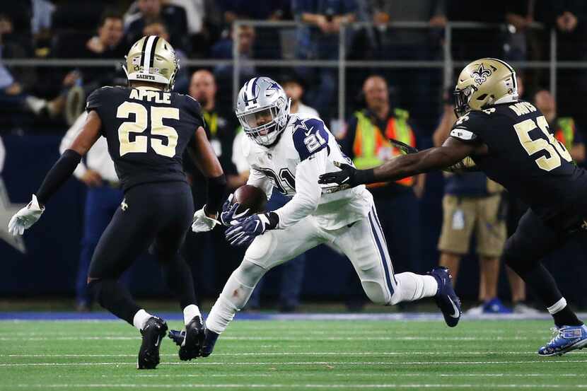 Dallas Cowboys running back Ezekiel Elliott (21) runs the ball against New Orleans Saints...