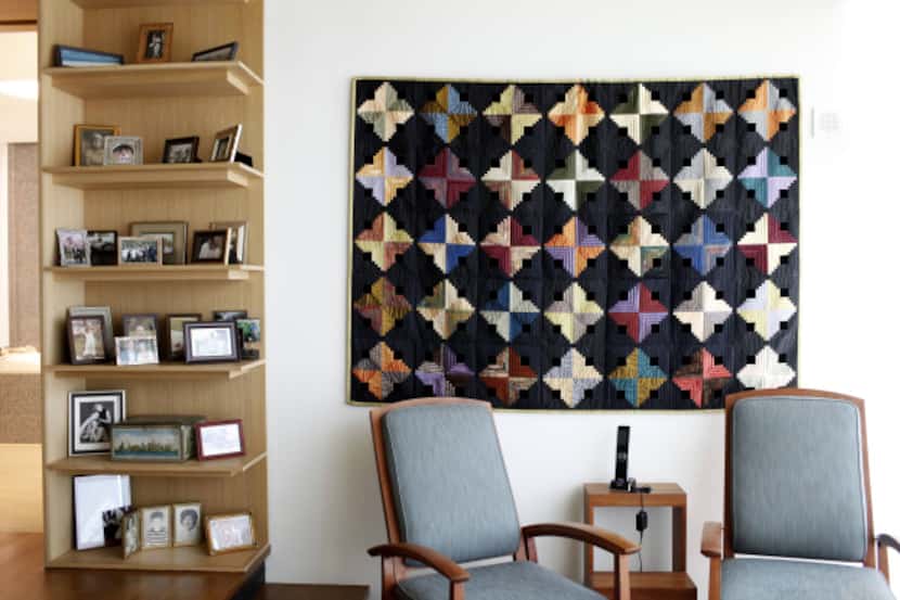 The condo's decor includes Cecilia Boone's quilts, including a log cabin-style design titled...