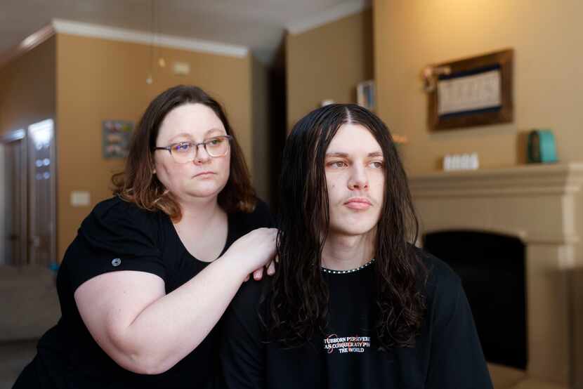 Laura Beth Kelley poses for a photo with her son Kegan Wright, 17, who works at the AMC...