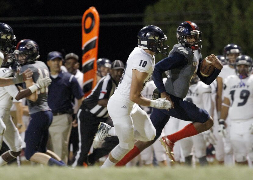 Bishop Dunne senior quarterback Caleb Evans (6) out runs Argyle Liberty Christian senior...