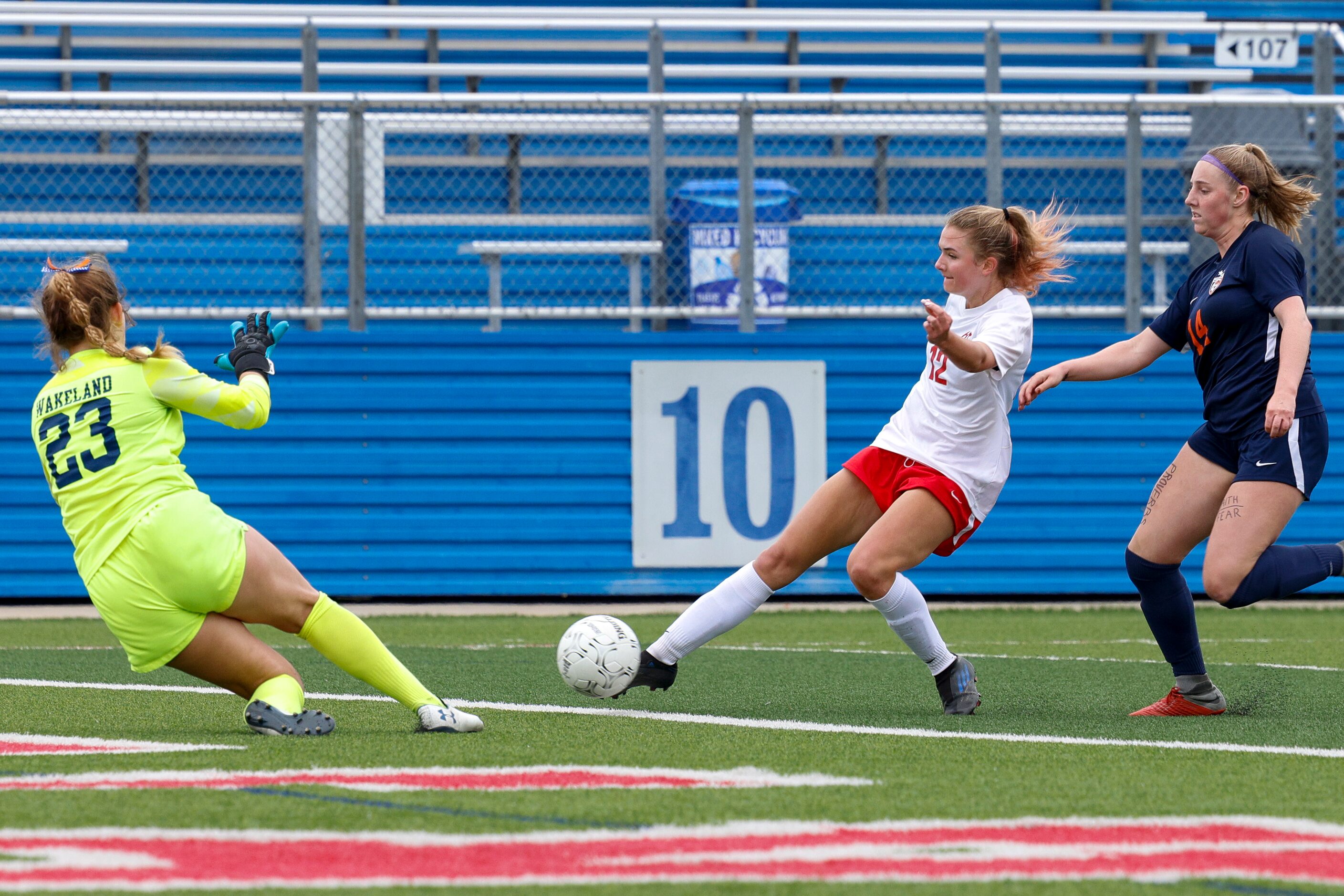 Grapevine forward Samantha Larsen (12) takes a shot on goal against a defending Frisco...