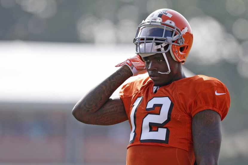FILE - In this Aug. 4, 2014, file photo, Cleveland Browns wide receiver Josh Gordon rests...