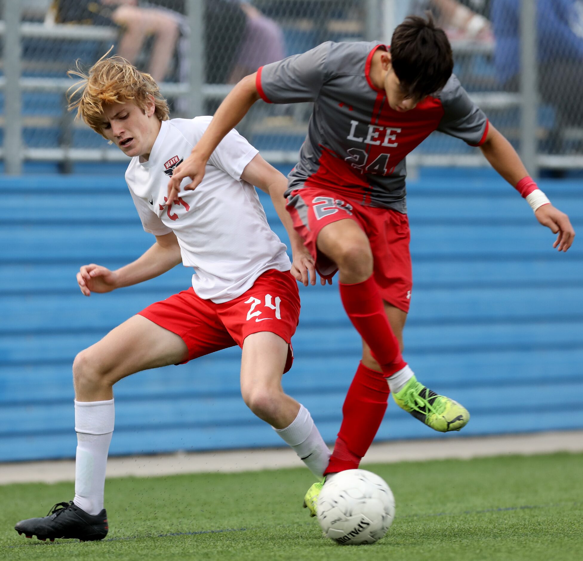 Rockwall-Heath's Brock Bernard (24) and SA Lee's Julian Sanchez (24) struggle for control of...