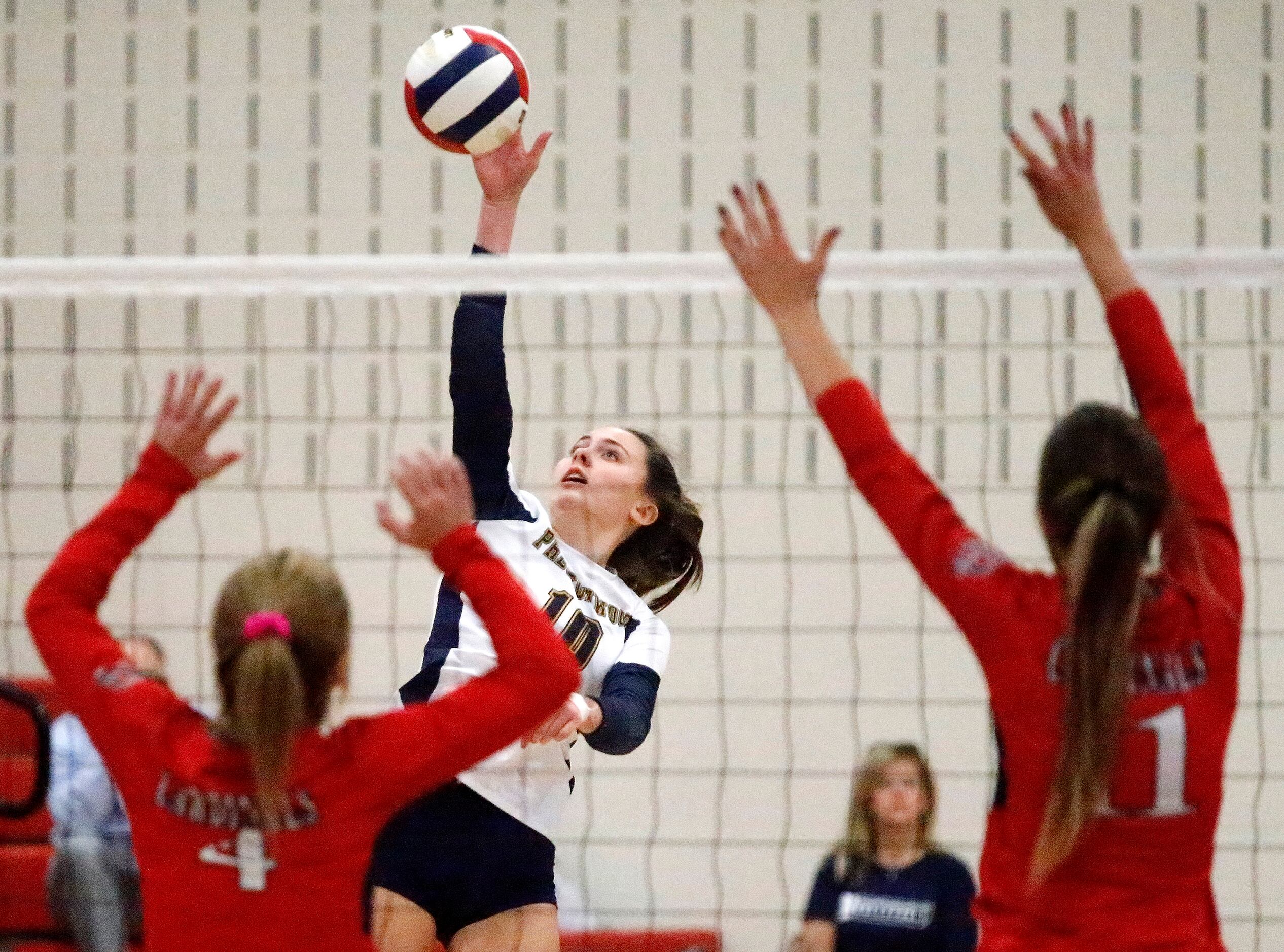 Prestonwood Christian Academy outside hitter Mikala Young (10) gets a hit during game one as...