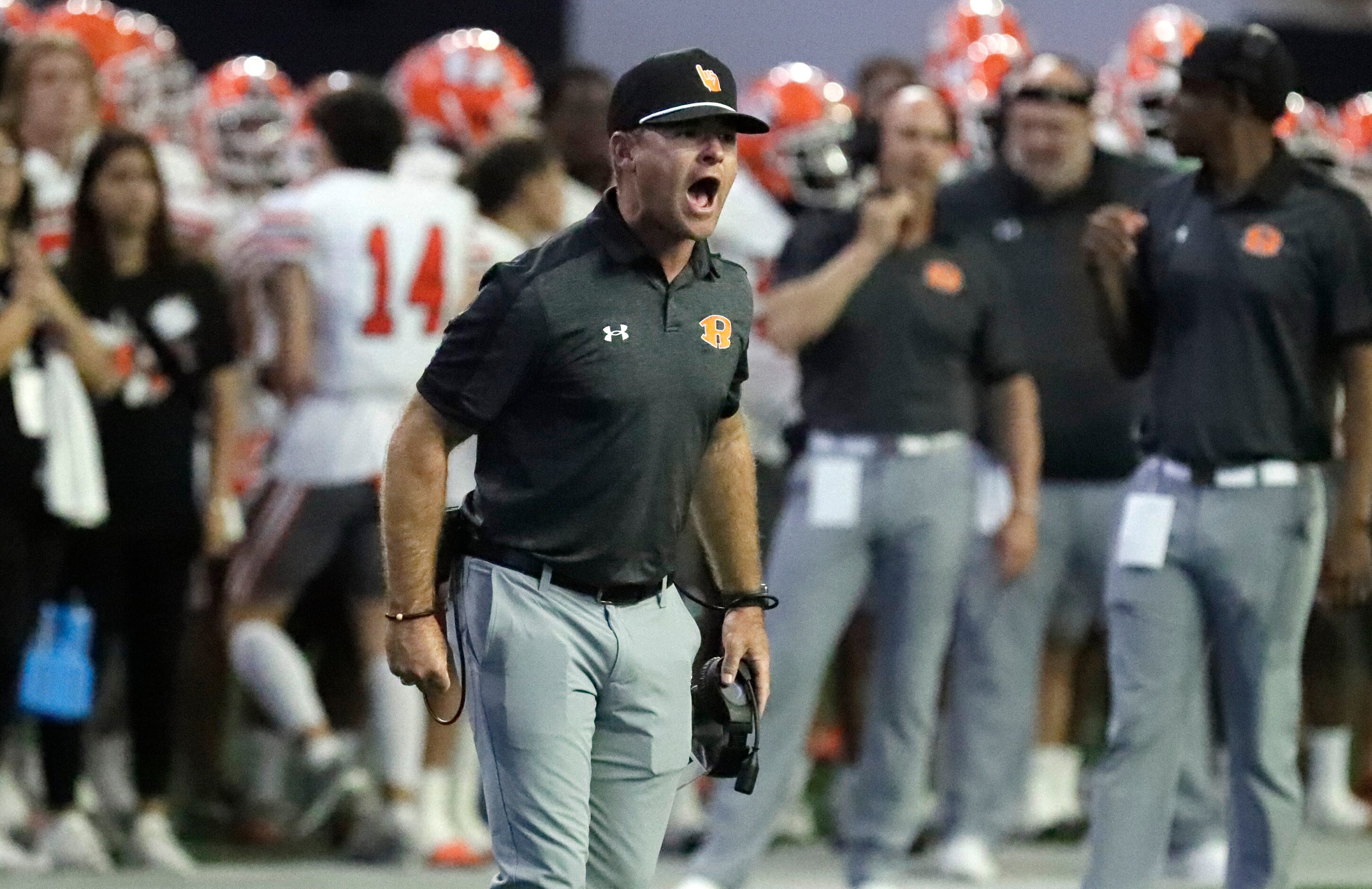 Rockwall High School head coach Trey Brooks yells for a call as Cedar Hill threatens to...