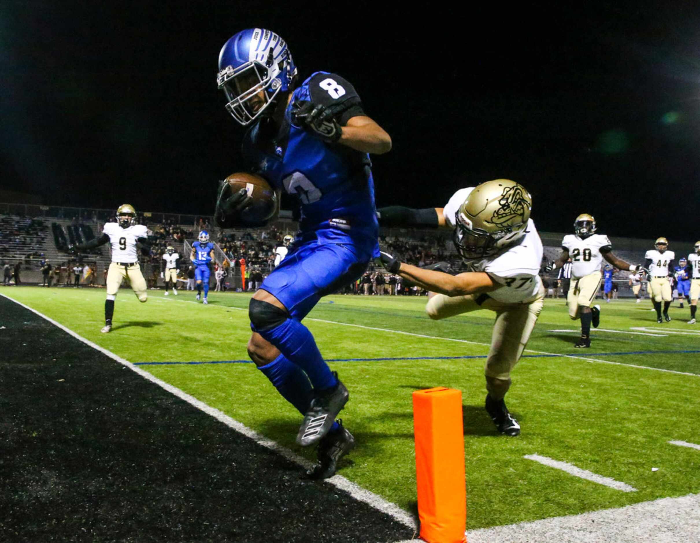 North Forney wide receiver Nick Booe (8) scores a touchdown past Royse City defensive back...