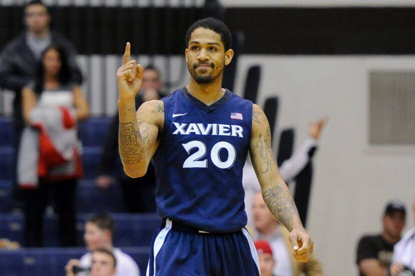 Former Xavier Musketeers forward Justin Martin (20) reacts following a game against the St....