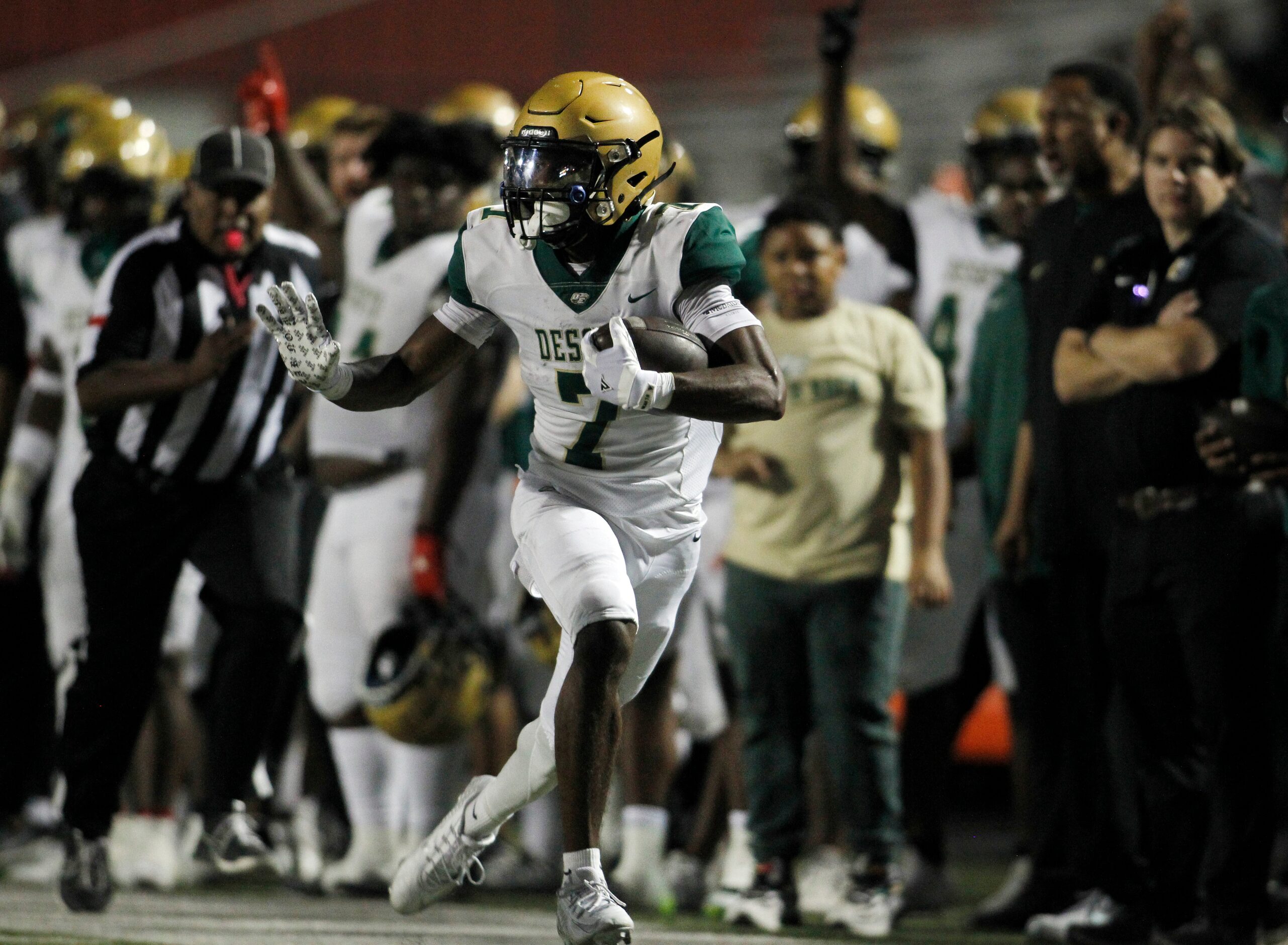 DeSoto receiver Anthony Pride Jr. (7) sprints for a long gain after pulling in a long...