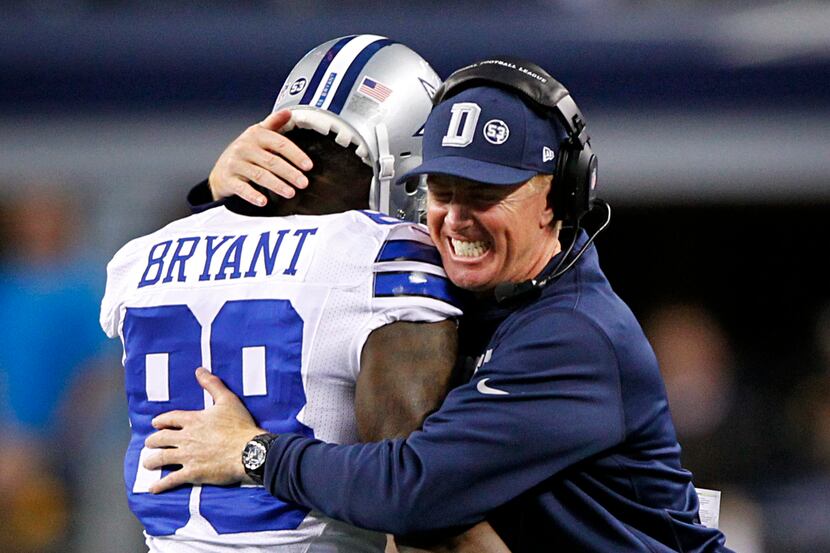 Dallas Cowboys head coach Jason Garrett congratulates Dallas Cowboys wide receiver Dez...