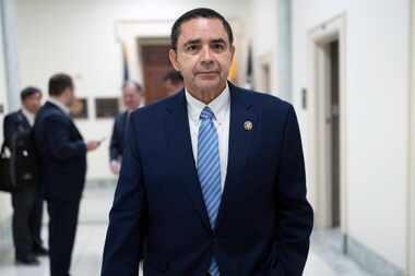 U.S. Rep. Henry Cuellar, D-Laredo, walks from his office to the House chamber to vote on...