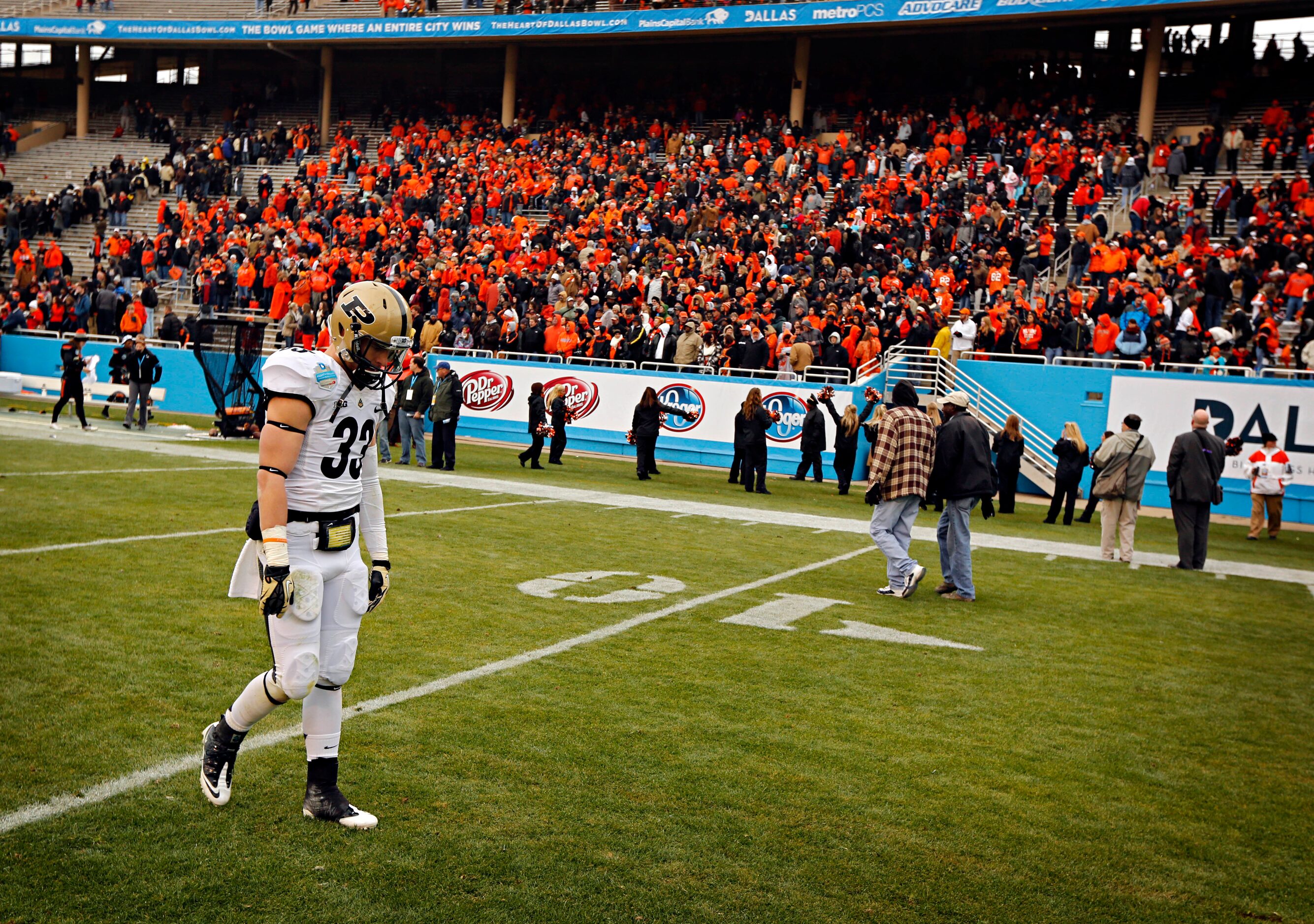 Purdue Boilermakers running back Danny Anthrop (33) hangs his head as he walks off the field...