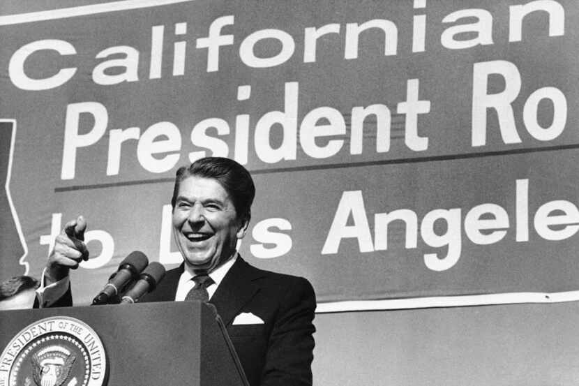 President Ronald Reagan points toward the crowd as he speaks during a rally at Pierce...