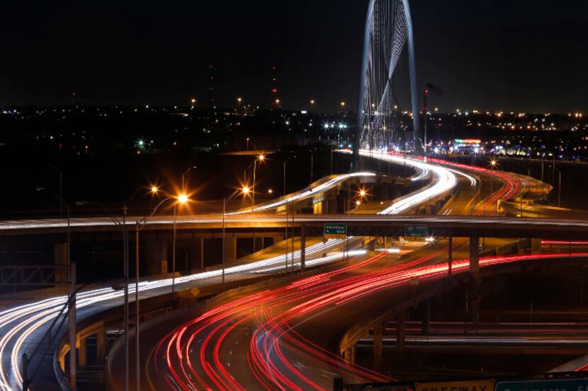 Traffic along Woodall Rodgers Freeway and Interstate 35 lead to and from West Dallas over...