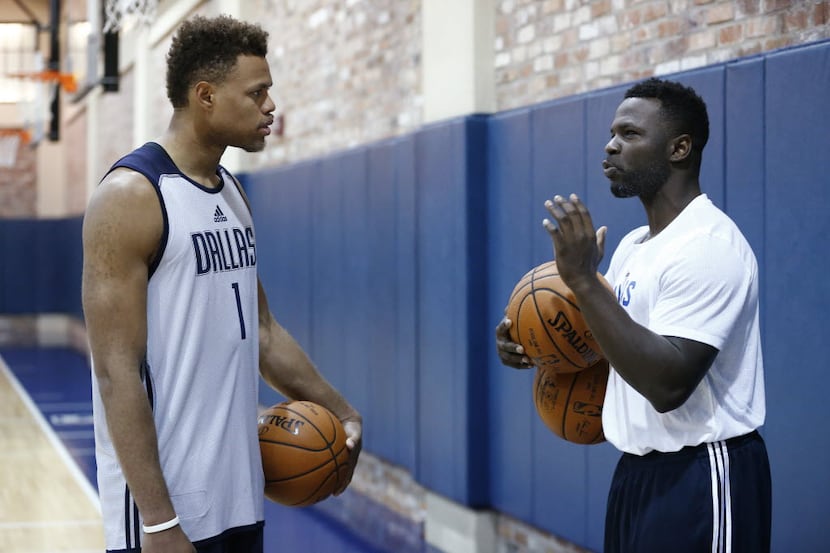 Justin Anderson (left) works with new dribbling coach Johnny Stephene (cq) during the Dallas...