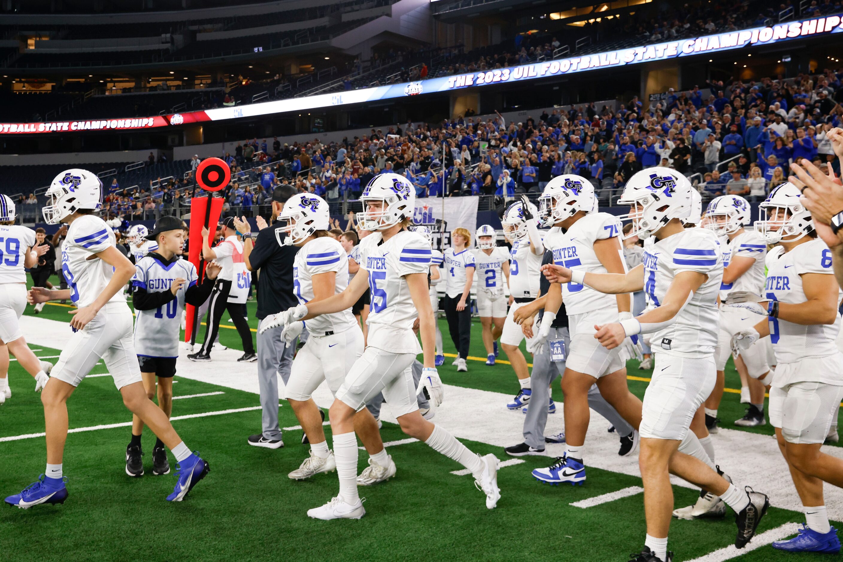 Gunter High players take the field after winning against El Maton Tidehaven during a Class...