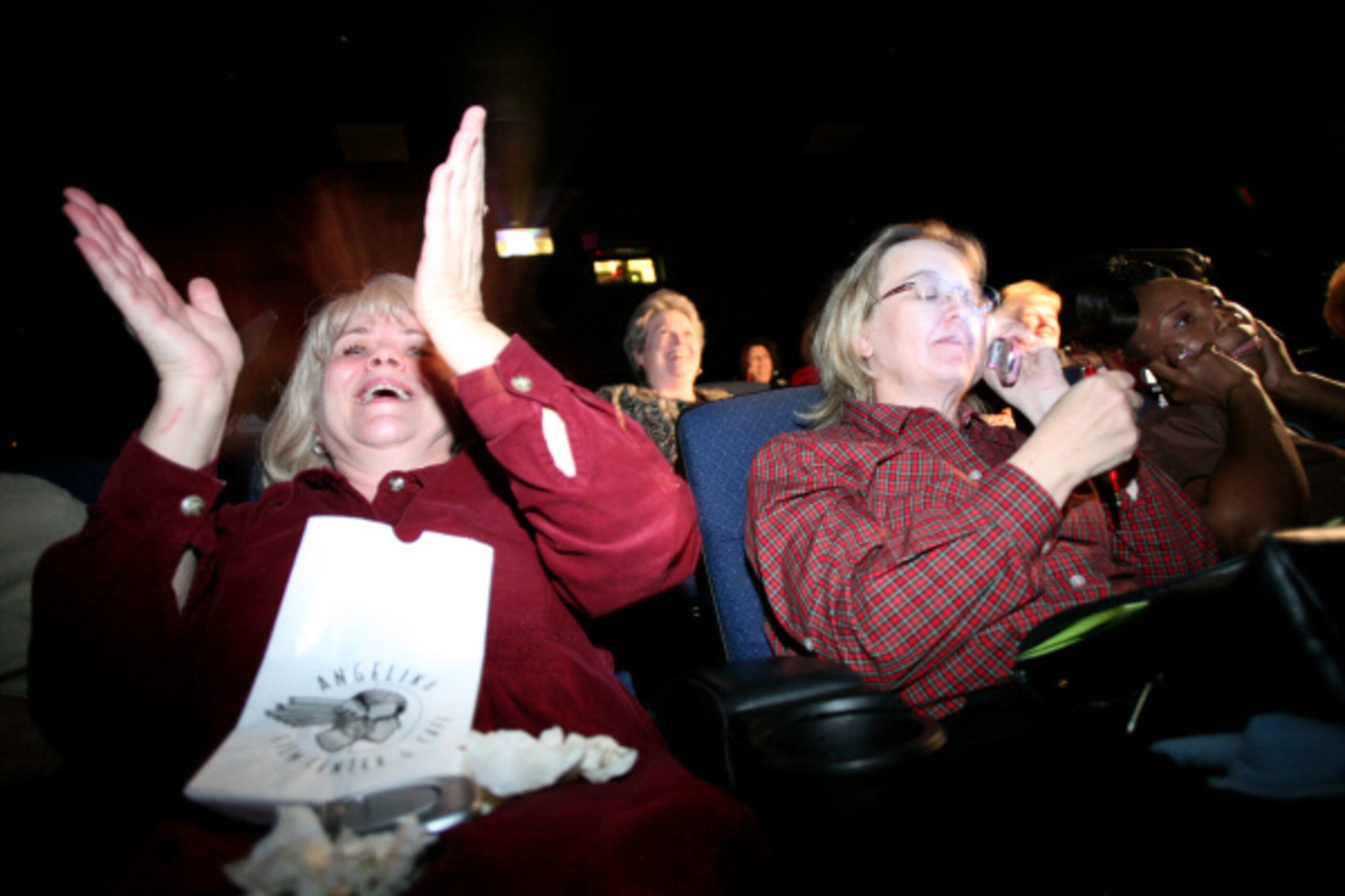 Donna Kelly (left) cheers as Susan Grantham calls in to vote as they watch "Dancing With The...