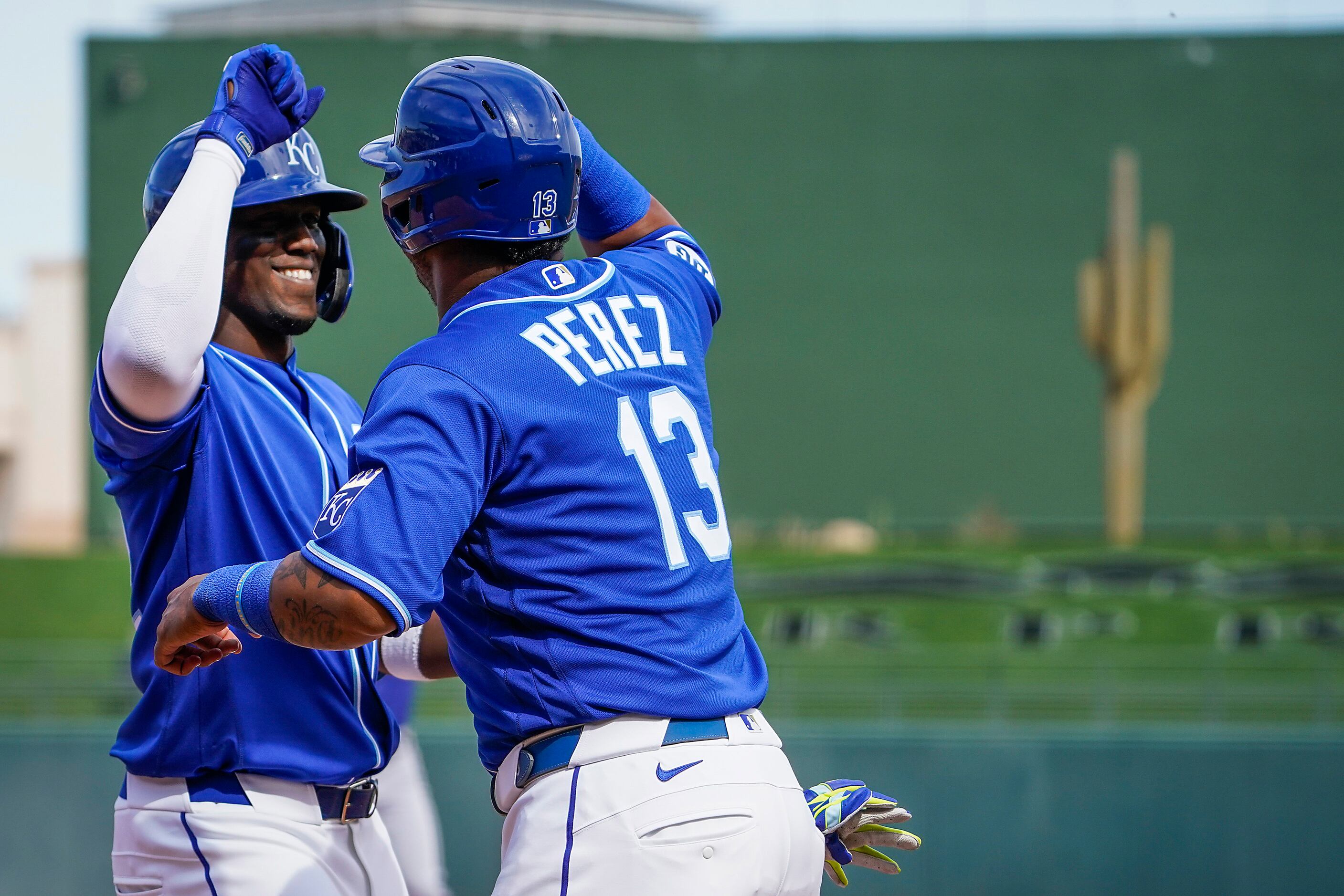 Kansas City Royals right fielder Jorge Soler (left) celebrates with catcher Salvador Perez...