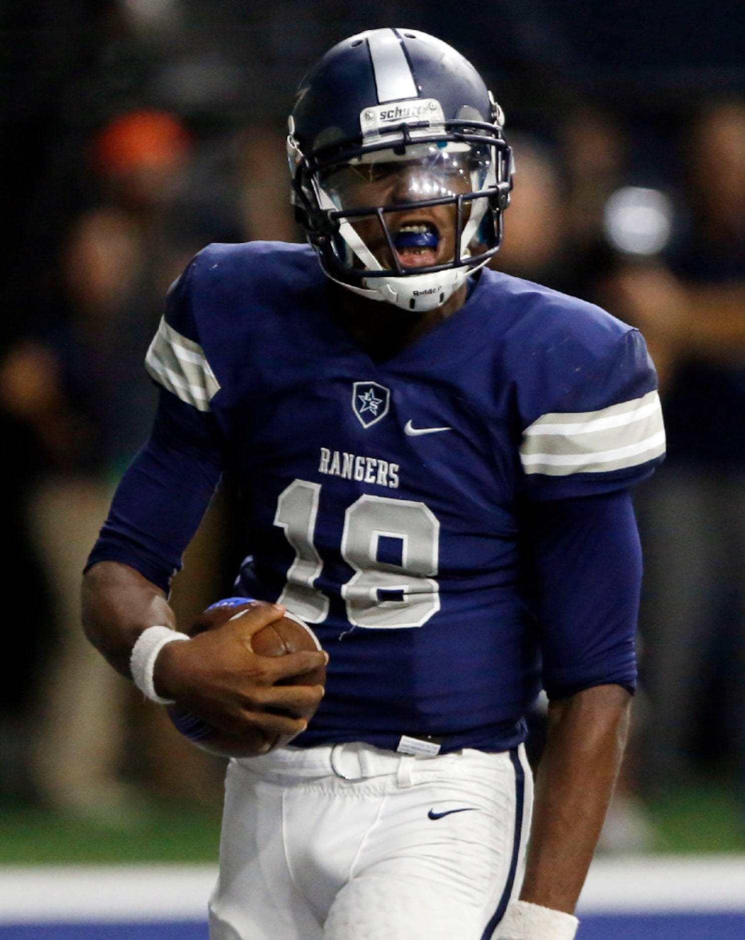 Frisco Lone Star High QB Jason Shelley (18) celebrates after scoring a touchdown during the...