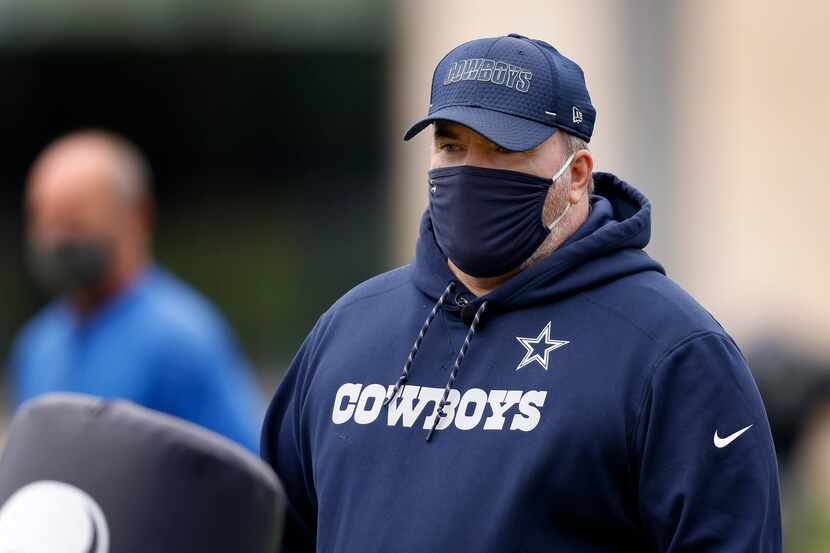 Dallas Cowboys head coach Mike McCarthy watch his rookies go through minicamp at The Star in...