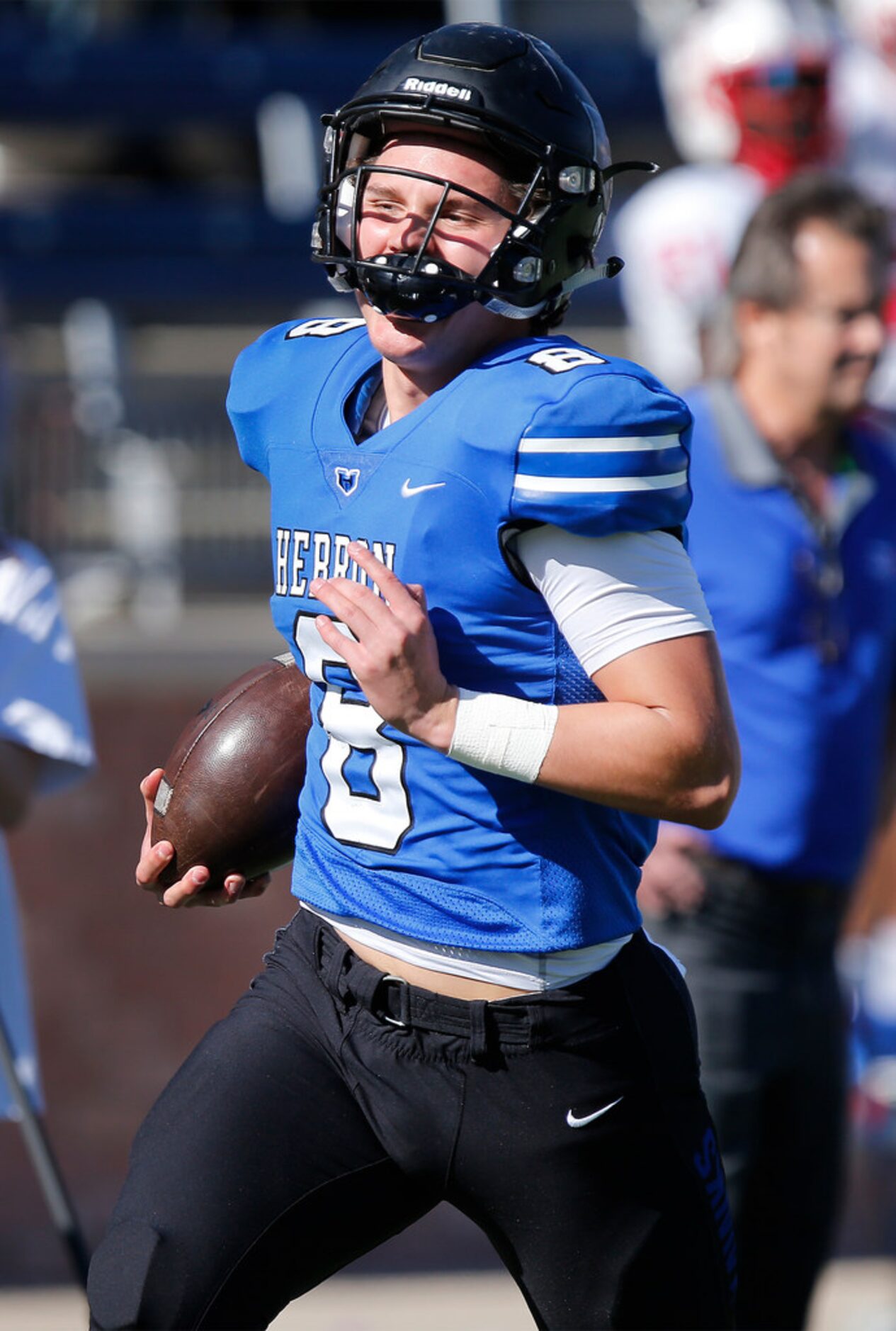 Hebron High School quarterback Carson Harris (8) runs alone down the sideline for a...