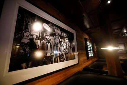 A David Yarrow photograph makes a statement above one booth at Lucky Dog Saloon.